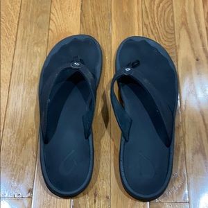 Olukai black flip flops